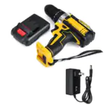 Yellow and black 20V cordless impact drill set with a detached battery, wall charger, and attached wrist strap on white