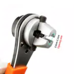 Close-up of adjustable ratchet wrench jaw gripping a bolt, marked with 0.6cm to 2.2cm opening size range
